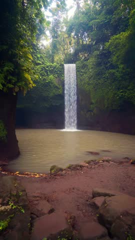 Beautiful Tibumana Waterfall on nature background. Bali, Indonesia 