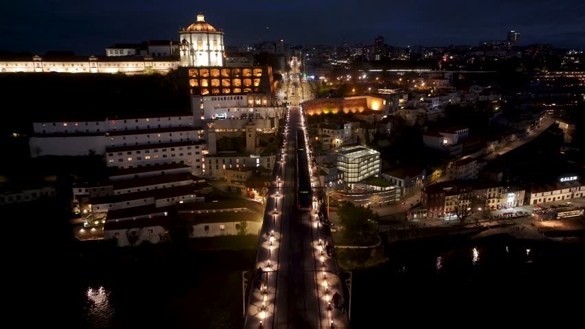 Night Dom Luis I Bridge At Porto In District Of Porto Portugal. City At Night Scene. Illuminated Bridge Landscape. Dom Luis I Bridge At District Of Porto Portugal. Railroad Transport.