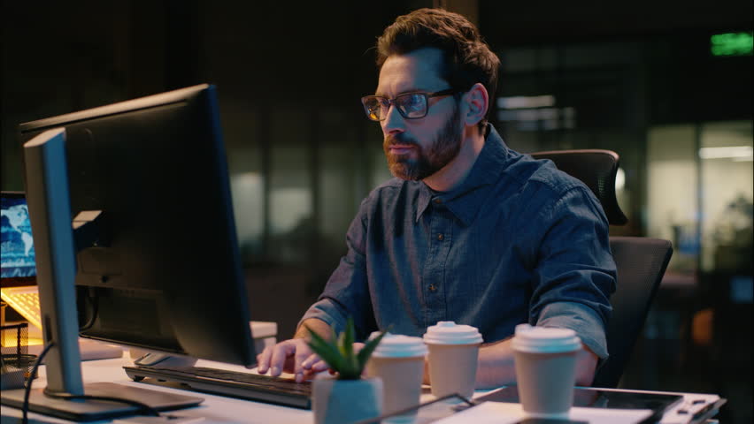 Caucasian business man businessman tired employee drink coffee night insomnia caffeine late working overtime evening office exhausted overwork overload stress computer deadline problem health headache