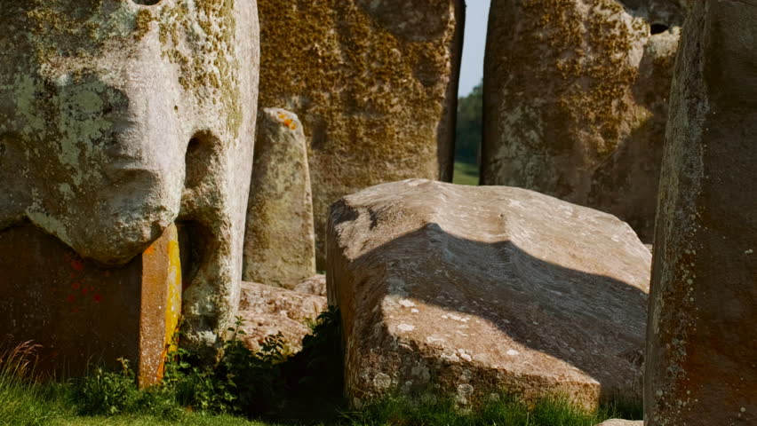 Stonehenge establishing shot underlining the megalithic stone rows that define its central horseshoe section, Salisbury, Wiltshire, England, UK
