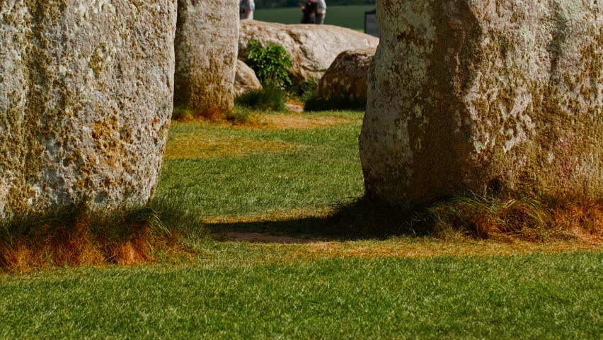 Stonehenge establishing shot revealing ground level perspective of interlocking stones forming sacred circle, Salisbury, Wiltshire, England, UK
