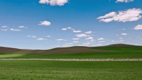 Serene Rolling Hills Landscape Under Blue Sky with Fluffy Clouds - Powered by Shutterstock - Get 15% off with code: PIKWIZARD15