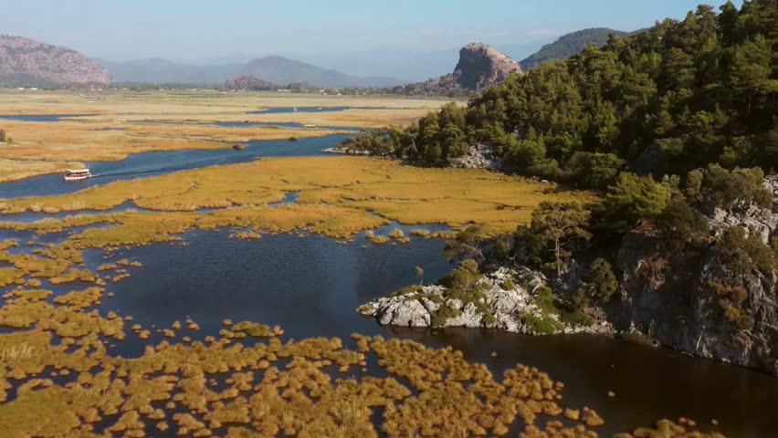 Aerial View of Serene Lake Landscape with Autumnal Vegetation