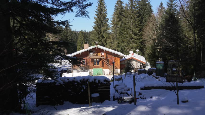 Holiday destination wood log cabin in France La Bresse forest alpine highlands winter
