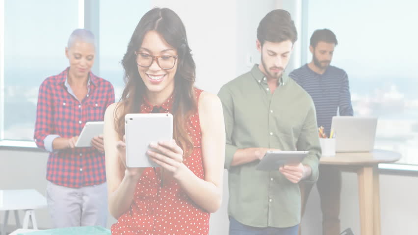 Business colleagues using tablets and laptop in office, displaying network sphere overlay. Collaboration, technology, urban, innovation, professional, networking, modern - Powered by Shutterstock - Get 15% off with code: PIKWIZARD15