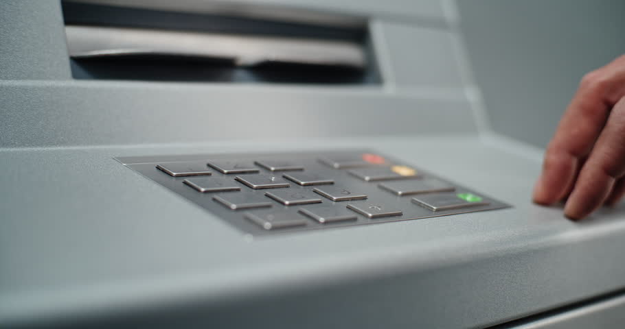 ATM Machine: Close Up of Unrecognizable Man Entering PIN Code for Cash Withdrawal Transaction from Bank Account, Pressing Buttons on Keypad. Automated Teller Machine, Banking System and Operations.