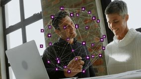 Two colleagues pointing at laptop in office, interacting with purple social media network overlay. Collaboration, teamwork, digital, innovation, modern, professional, connectivity - Powered by Shutterstock - Get 15% off with code: PIKWIZARD15