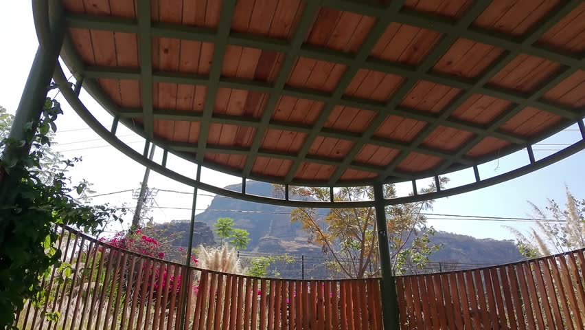 Pull out shot of a patio in a garden with the sun shining during the day in Tepoztlan, state of Morelos, Mexico, outdoor