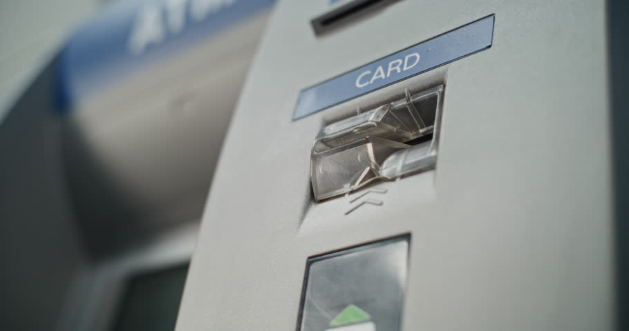 ATM Machine in Airport Terminal: Close Up Shot of Unrecognizable Person Inserting Plastic or Credit Card Into Card Slot for Money Withdrawal Operation. Cash Machine, Banking Services and Transactions.