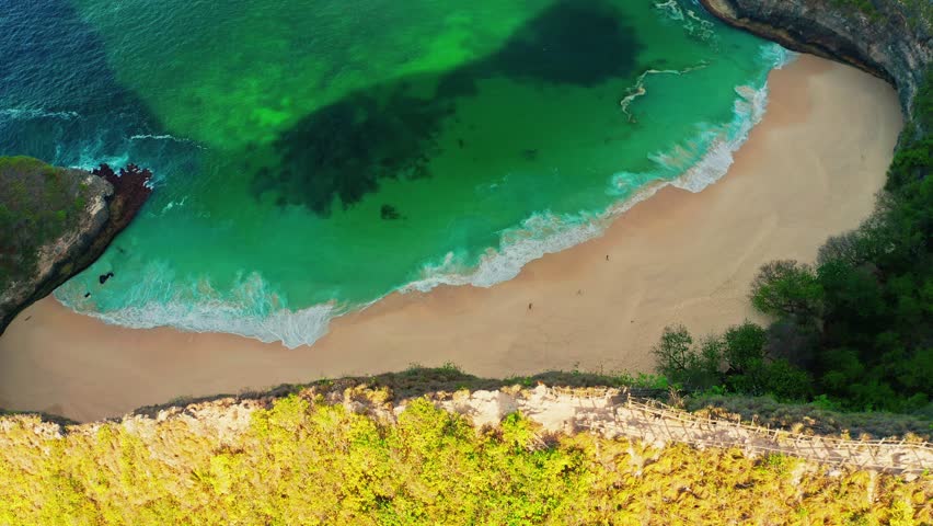 Kelingking Beach, Nusa Penida is one of the most incredible place for visit in Indonesia the eyes of travelers have a view amazing natural landscape, similar Jurassic world. Bali, Indonesia. 4K Aerial