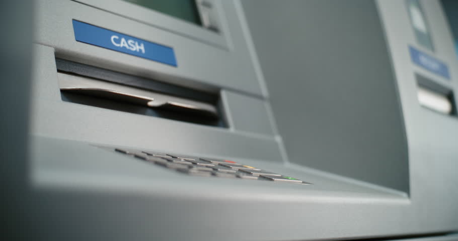 Unrecognizable ATM User Pressing Buttons on ATM Keypad, Entering PIN for Cash Withdrawal Transaction, Taking Money. Automated Teller Machine, Cash Machine. Banking Services and Operations. Close Up