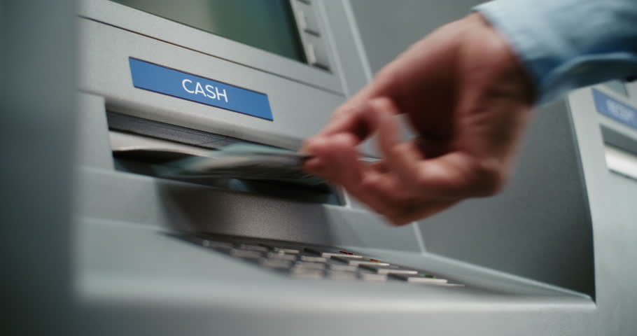 Unrecognizable ATM User Pressing Buttons on ATM Keypad, Entering PIN for Cash Withdrawal Transaction, Taking Money. Automated Teller Machine, Cash Machine. Banking Services and Operations. Close Up