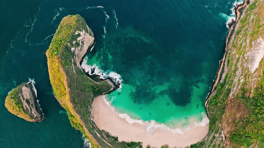 Kelingking Beach, Nusa Penida is one of the most incredible place for visit in Indonesia the eyes of travelers have a view amazing natural landscape, similar Jurassic world. Bali, Indonesia. 4K Aerial