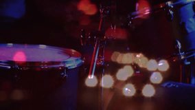 drum cymbal being struck in dark performance, with flickering bokeh lights glowing in flat design. Musician, performance, illumination, stage, rhythm, energy, motion - Powered by Shutterstock - Get 15% off with code: PIKWIZARD15