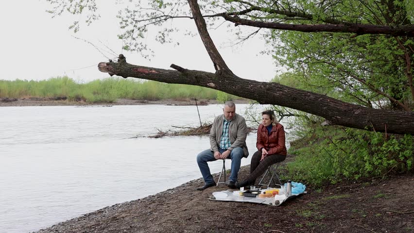 A man and a woman had a picnic in nature. Active recreation in nature.