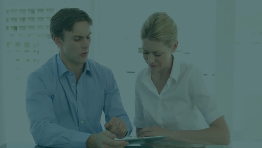 Male and female colleagues reviewing business data on tablet displaying floating numbers and waves. Collaboration, data analysis, teamwork, digital interface, modern office, analytics, professional - Powered by Shutterstock - Get 15% off with code: PIKWIZARD15