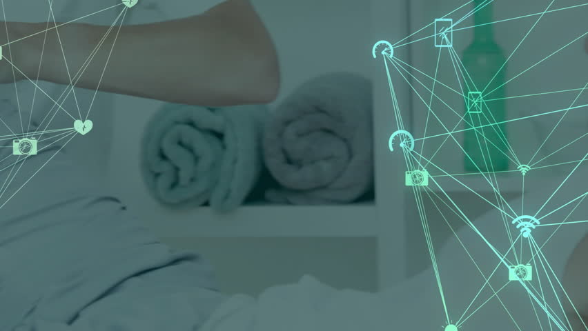 Mid adult woman sitting at home office, showing tech with turquoise network connecting icons. Connectivity, communication, digital, technology, innovation, modern, workspace - Powered by Shutterstock - Get 15% off with code: PIKWIZARD15