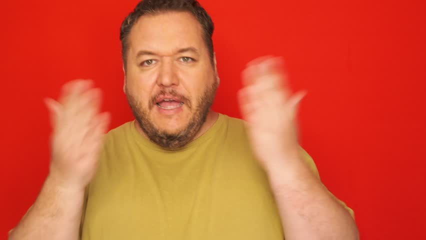 A grown angry man swears.