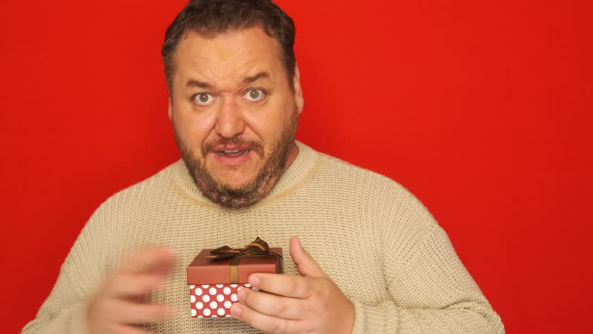 Funny man and a box with a gift.