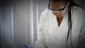 Gloved lab technician holding pipette, dispensing liquid in laboratory with green network overlay. Research, analytics, precision, biotech, innovation, scientific, technology - Powered by Shutterstock - Get 15% off with code: PIKWIZARD15