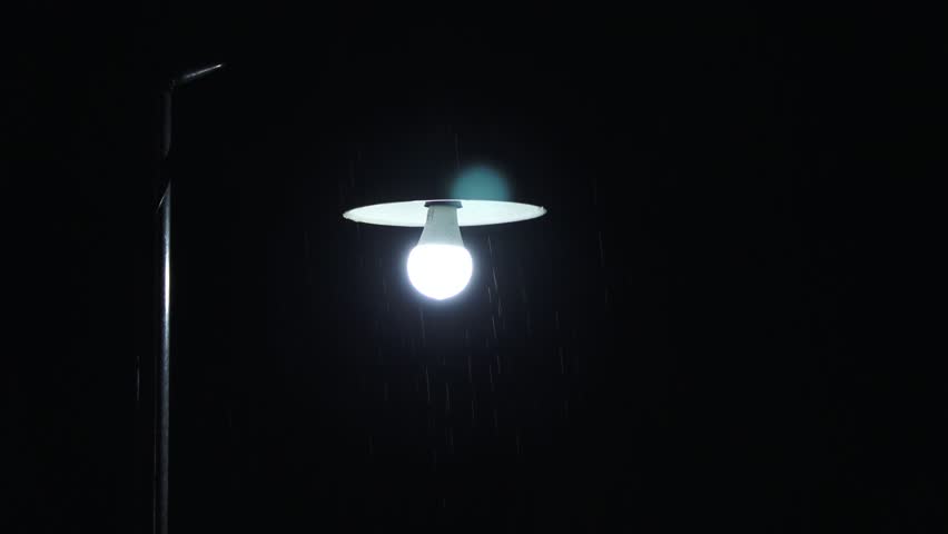 Steady Background, Public street light, located in front of one of the houses, there is a small pole visible, round bulb light, night and rain, 4K.
