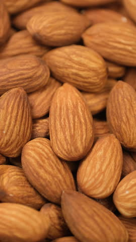 Macro Almonds top view, rotation. Whole almond nuts