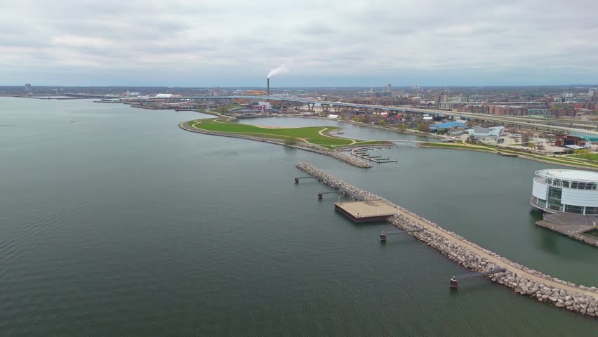 Milwaukee Wisconsin city skyline with modern skyscrapers captured from Lakeshore State Park along Lake Michigan waterfront.
