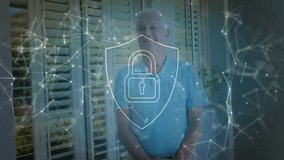 Mature couple standing by window shutters, showcasing digital security shield and network overlay. Elderly, protection, networking, safety, technology, security, home - Powered by Shutterstock - Get 15% off with code: PIKWIZARD15