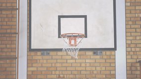 Basketball passing through hoop on white backboard with black frame showing network icons floating. Sports, technology, connectivity, digital, urban, motion, modern - Powered by Shutterstock - Get 15% off with code: PIKWIZARD15