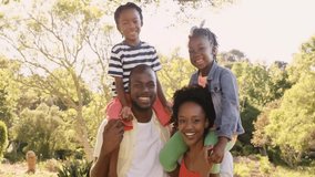 Family holding children in yard showcasing technology with neon green cyan digital particle overlay. Family, outdoor, vibrant, futuristic, harmony, leisure, innovation - Powered by Shutterstock - Get 15% off with code: PIKWIZARD15