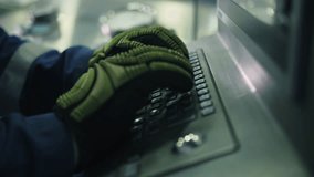 Worker operating industrial control panel with gloves - Powered by Shutterstock - Get 15% off with code: PIKWIZARD15