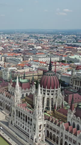 Aerial view of Budapest city and Hungarian Parliament building on Danube river, Hungary. Vertical video
