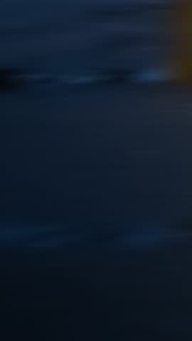 Blurred wet asphalt road in motion creates a visual speed effect