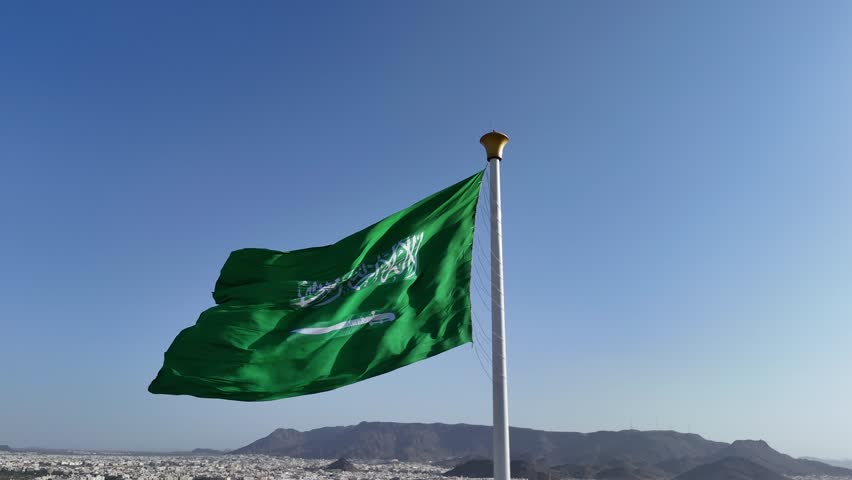 Saudi Arabia flag waving in the sky - Saudi national day and Founding Day