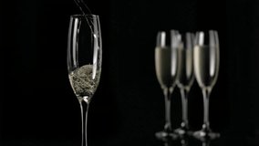 Champagne flute being filled with sparkling bubbles rising, blurred flutes and heart icons floating. Celebration, elegance, luxury, romance, glamour, sparkle, festive - Powered by Shutterstock - Get 15% off with code: PIKWIZARD15
