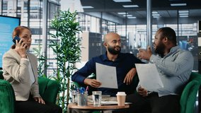 Woman business leader interrupting a meeting for an insightful phone call, discussing some important details on the telephone line. Diverse ambitious CEOs during a conference. Camera B. - Powered by Shutterstock - Get 15% off with code: PIKWIZARD15