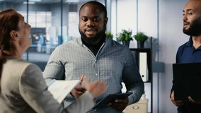 Business professionals shaking hands and reaching an agreement after the meeting, exchanging a handshake and giving their consent. CEOs making an alliance for global growth. Camera B. - Powered by Shutterstock - Get 15% off with code: PIKWIZARD15