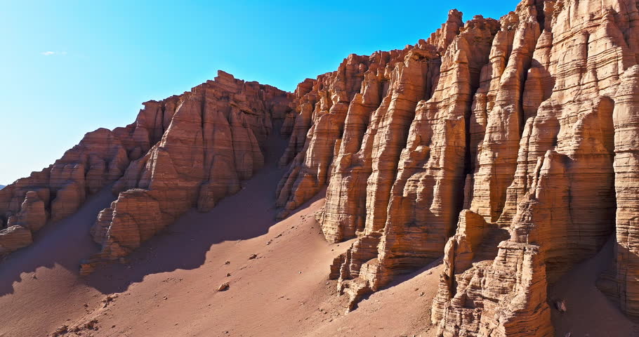 Aerial view of yardang landform mountain in desert. Famous Dahaidao no man's land natural landscape in Xinjiang, China.