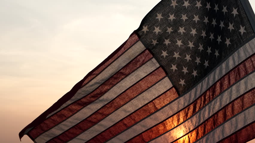 Memorial Day USA. Remember and Honor. Silhouettes of American flag waving on background of beautiful sunset or sunrise for honoring, mourning USA military. Memorial Day, Happy Holiday American Concept