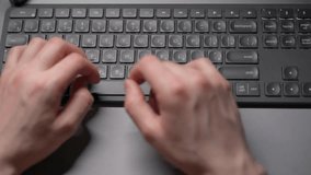 Close-up view of fingers on a keyboard from above. A person typing on the keyboard. - Powered by Shutterstock - Get 15% off with code: PIKWIZARD15