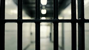 Black Prison Bars in a Hallway Representing Incarceration and Justice - Powered by Shutterstock - Get 15% off with code: PIKWIZARD15