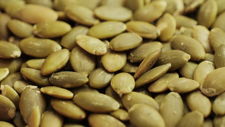 Pumpkin seeds close-up. Healthy vegetarian snack. High quality 4k footage