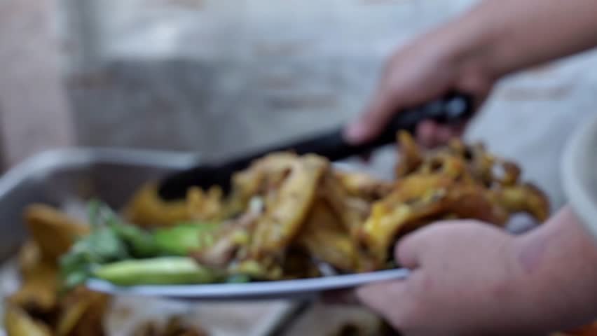 A plate of chicken - fried chicken, cucumber and fresh vegetables, suitable for food videos, stock videos, video editing materials and social media posts.