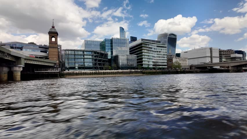 Modern buildings along thames river in london, uk, create a stunning cityscape
