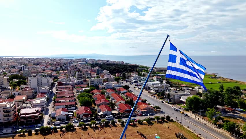 The largest Greek Flag being raised in the city of Alexandroupolis for its Independence day celebration