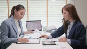 Expert woman asian people discuss review data number costing managerial account prepare monthly actual cost variance report income tax at audit office. ESG budget control ERP process service project. - Powered by Shutterstock - Get 15% off with code: PIKWIZARD15
