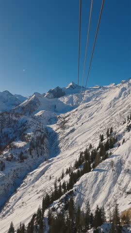 Cablecar Over Snowy Mountains in Kaprun, Austria, Vertical View of Winter Alps Landscape