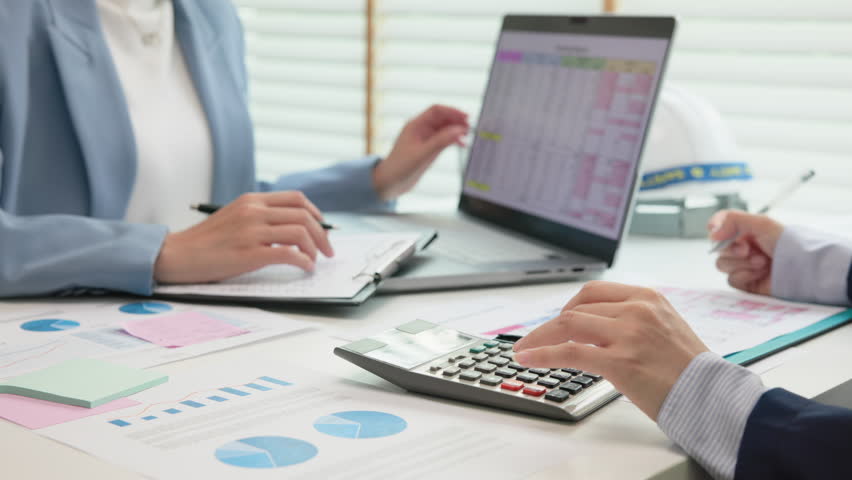 Expert woman asian female people review data number costing managerial account prepare monthly actual cost variance report income tax at audit office. ESG budget control ERP process service project.