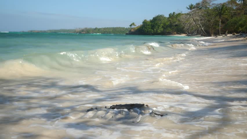 Car engine washed up on a beautiful beach. Local Beach life. Papuan fjords in Papua New Guinea. High quality 4k footage