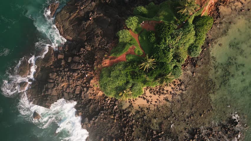 Aerial top down zoom view Tourists Sightseeing Parrot rock Island surrounded by turquoise waters and lush mangroves, this small tropical island in sri lanka coastline